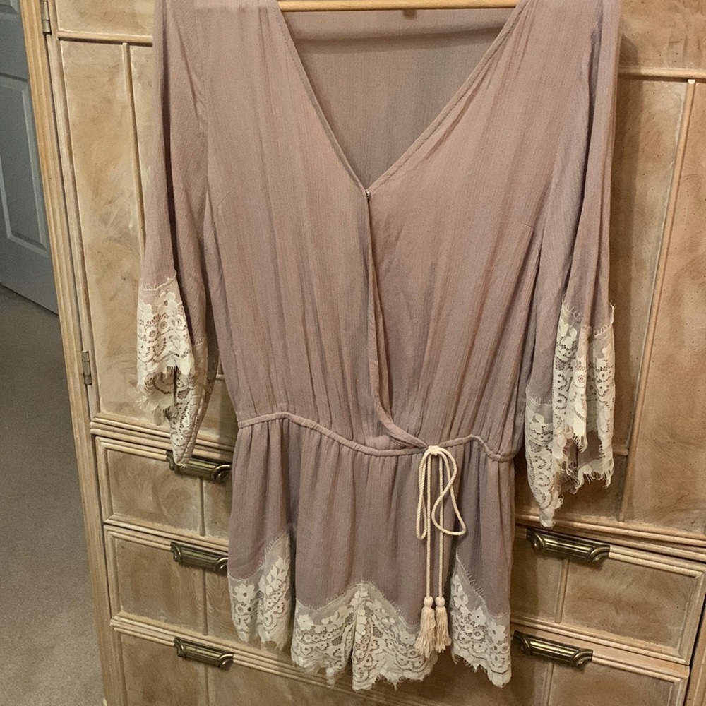 Beautiful jumper with lace trim on sleeves & lower shorts. Smoke & pet free home